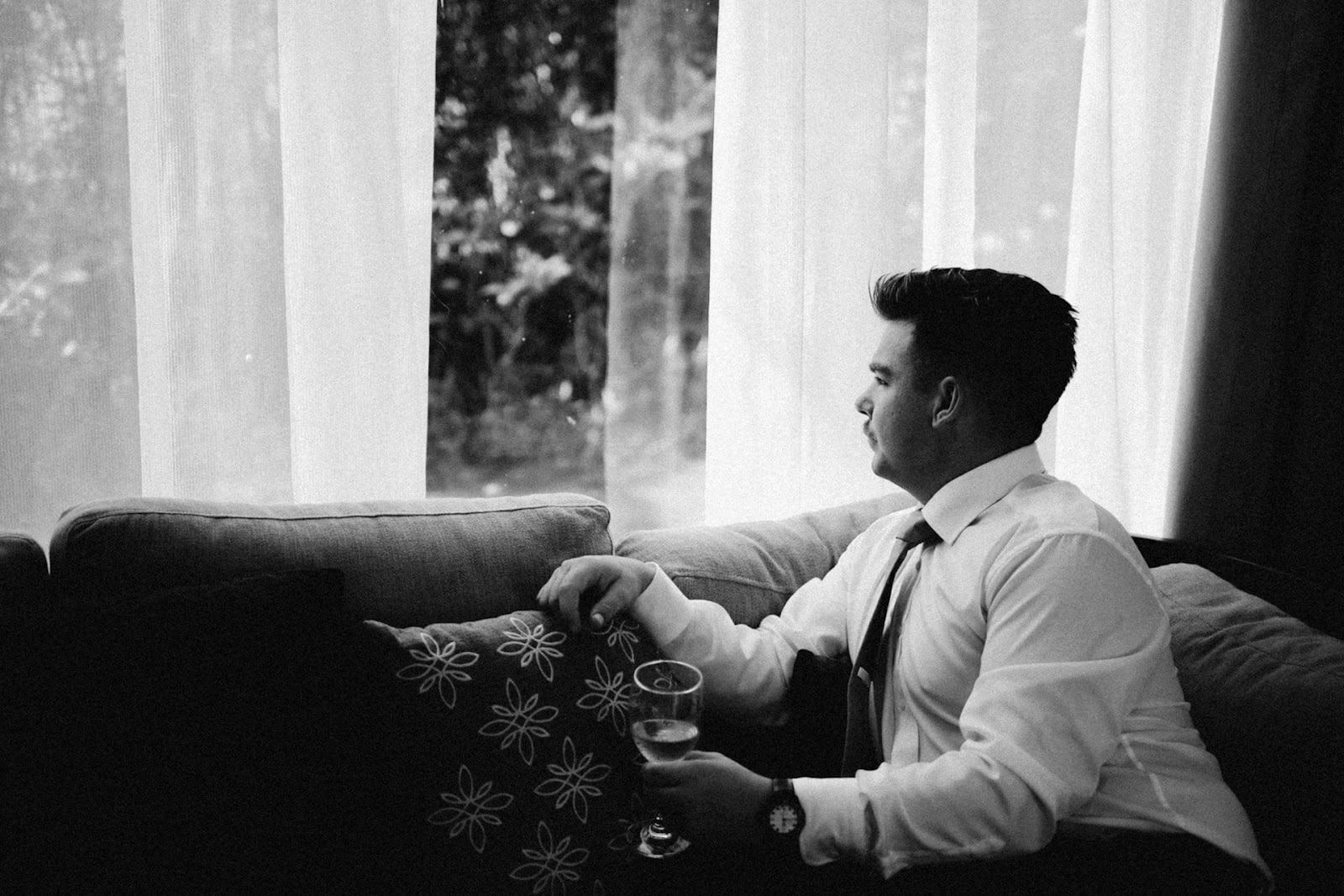 pensive man window