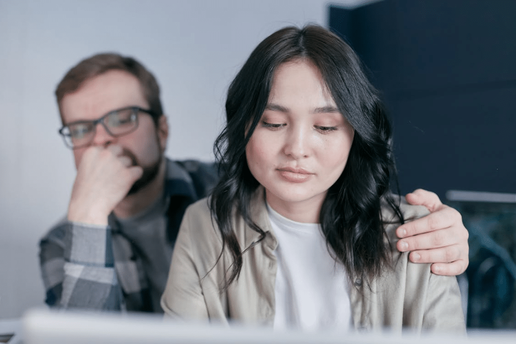 A Man Holding a Woman on her Shoulder