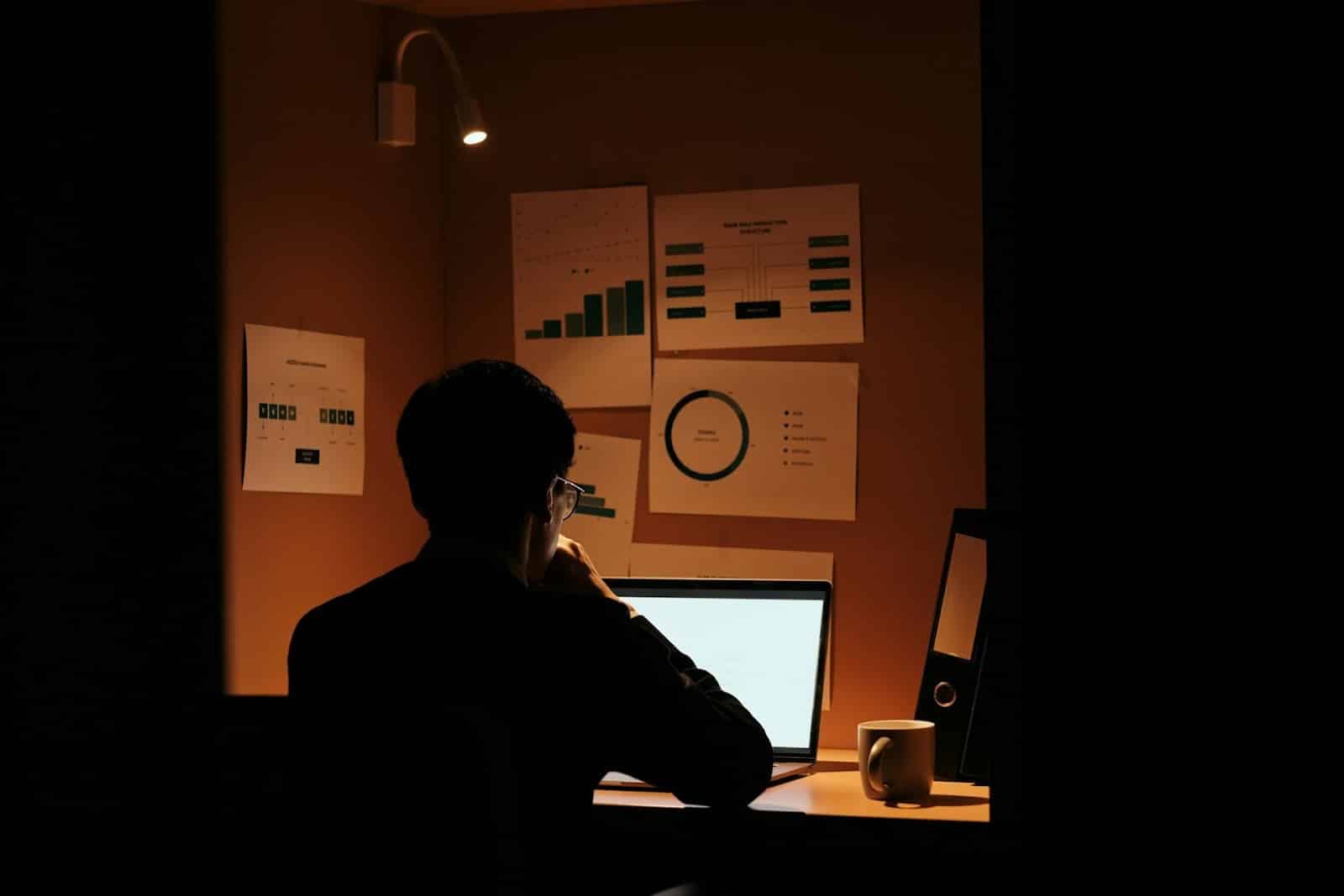 man working late office
