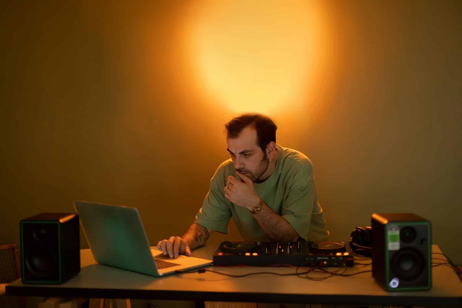 man closing laptop evening