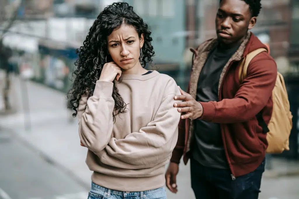 A woman ignoring a man in the street