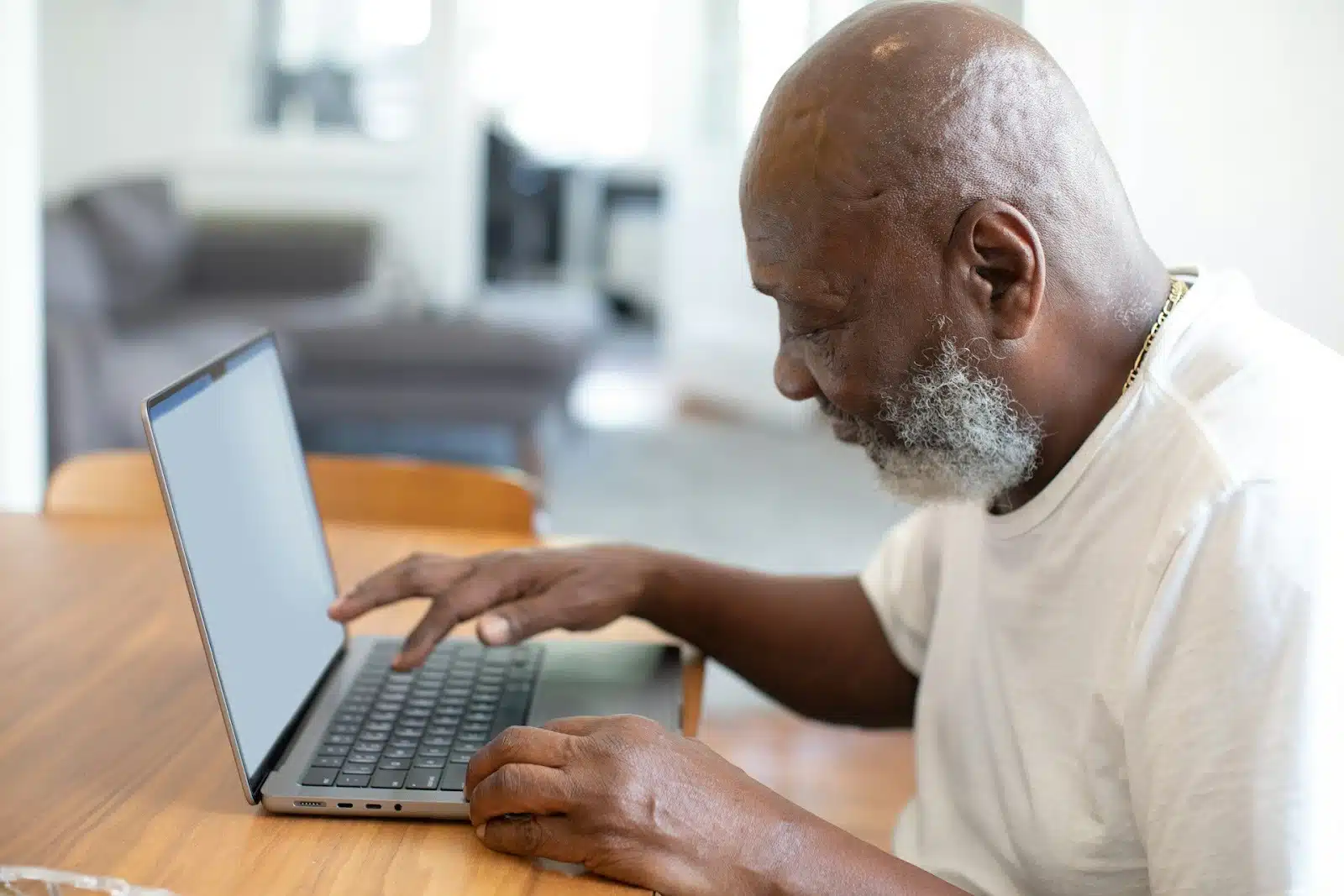 man using laptop home