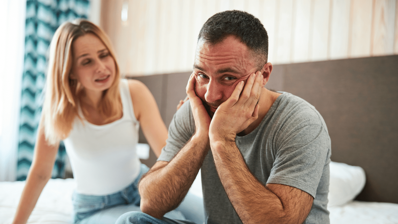A man looking unhappy in his marriage