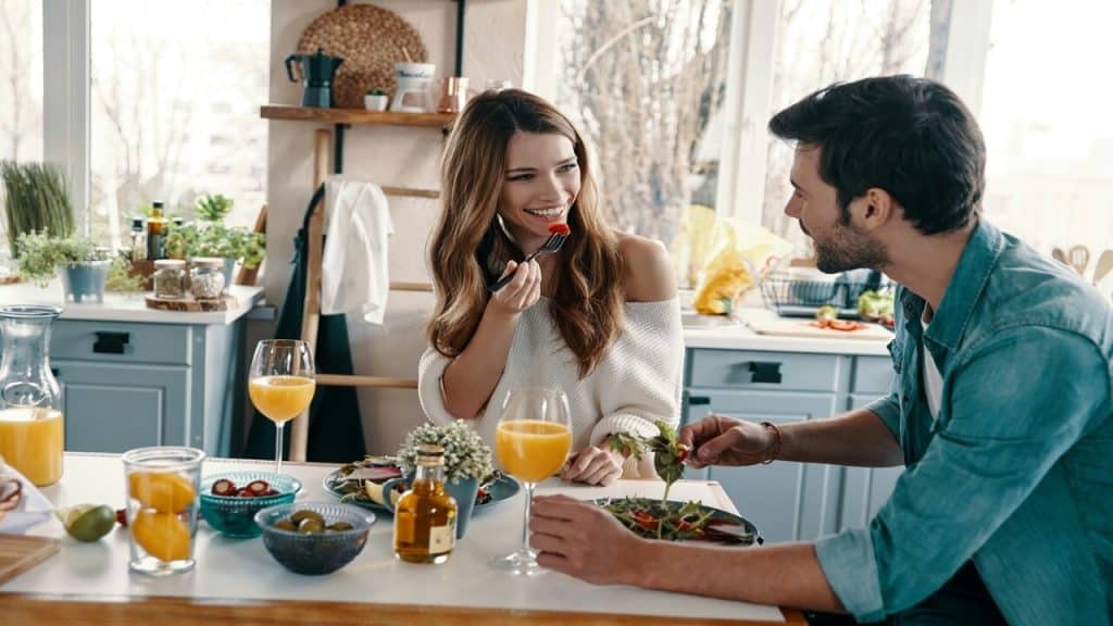 A couple having a brunch date at home