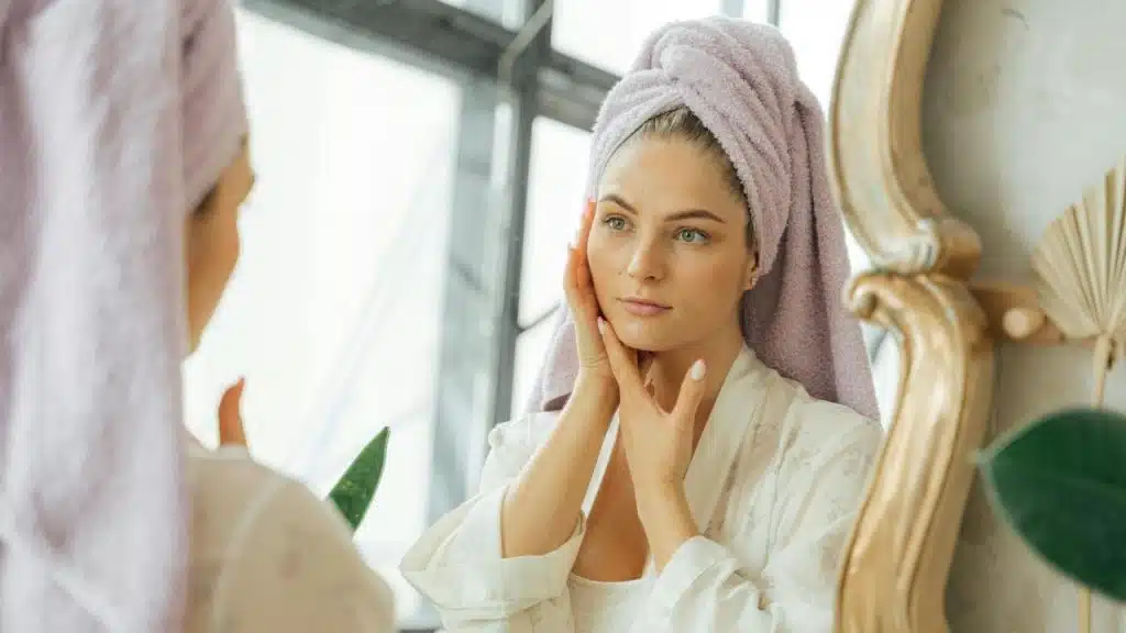 A woman with a towel wrapped around her hair