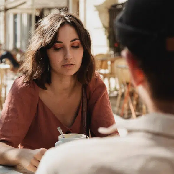 A couple talking in a cafe
