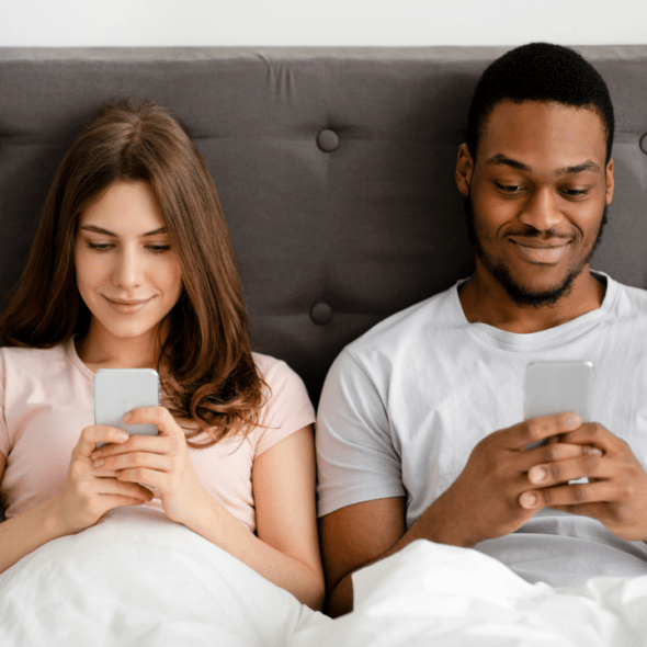 A couple busy with their phones