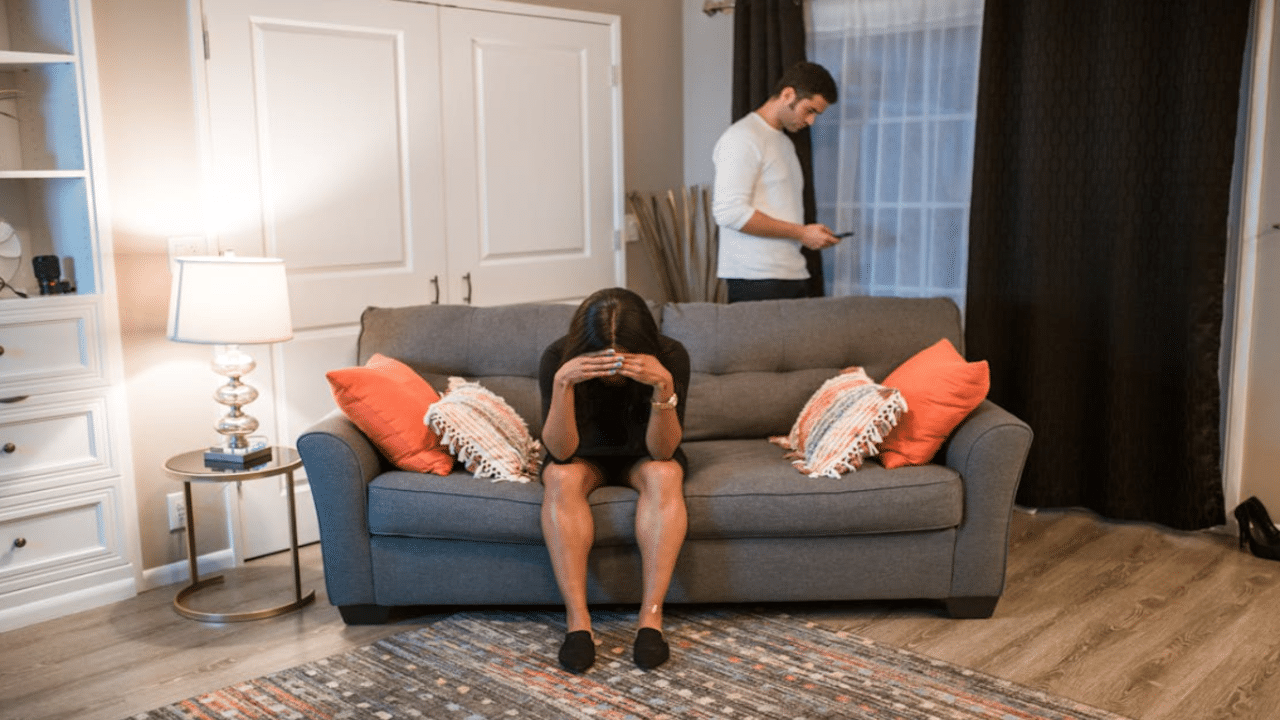 A couple ignoring each other at home