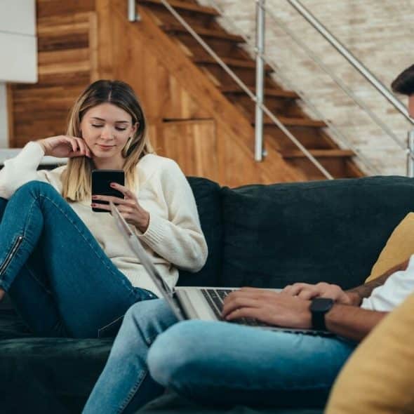A couple busy with their devices