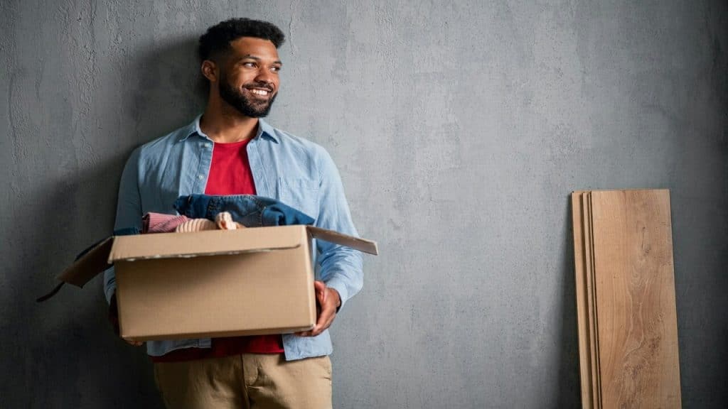 A man carrying moving boxes