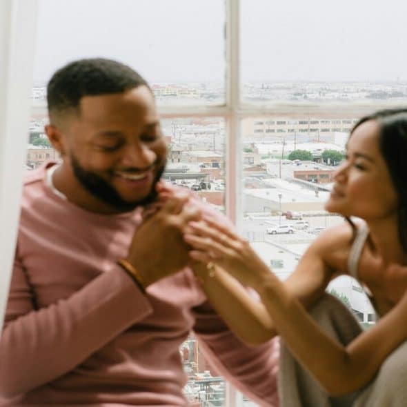 A couple sitting by the window