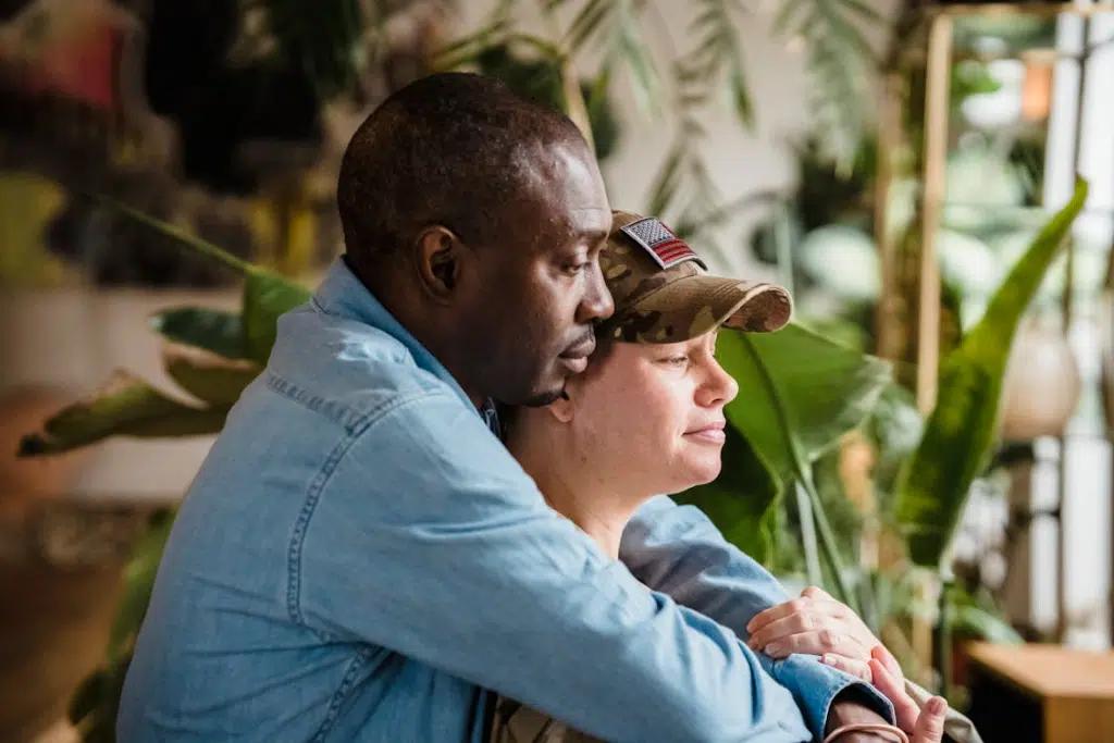 A man hugging a woman from behind