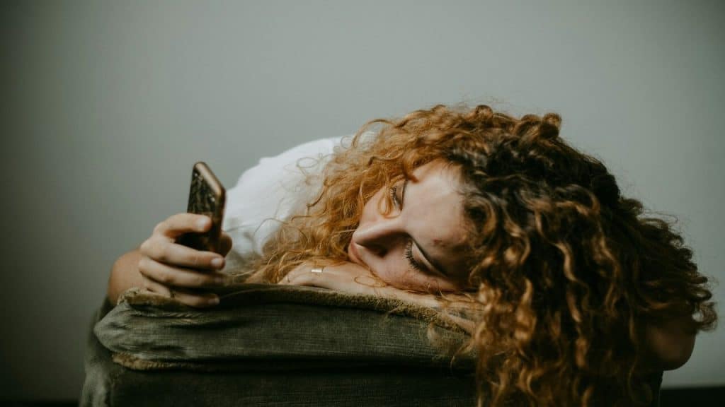 A woman waiting for a text