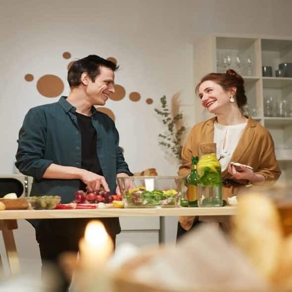 A couple talking in the kitchen