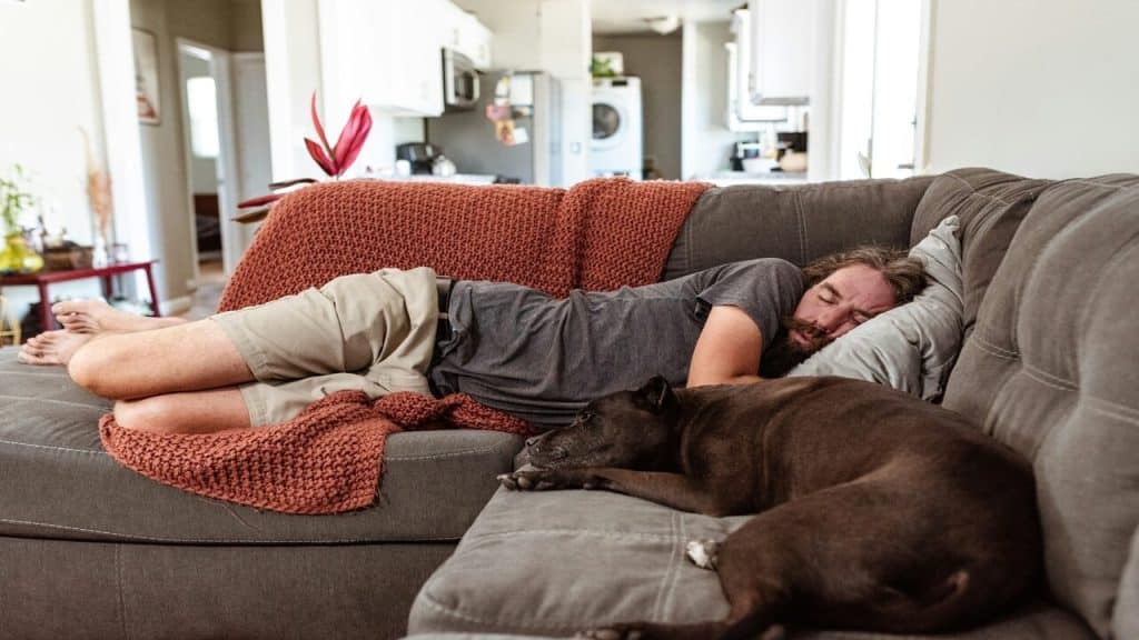 A man sleeping on the couch