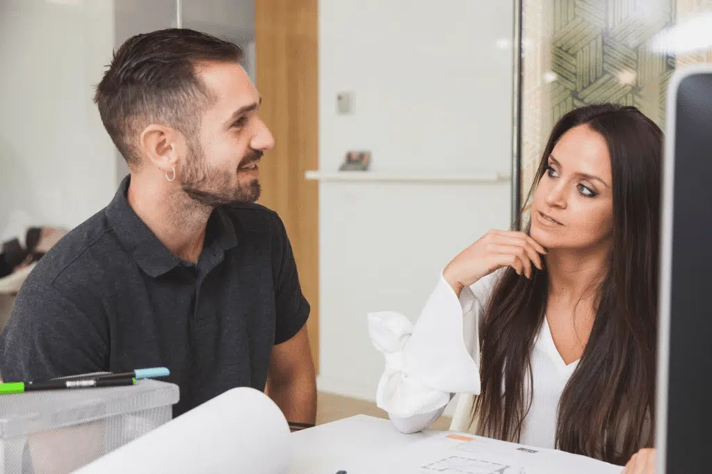 A man explaining to woman