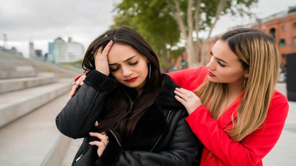 A woman comforting her upset friend