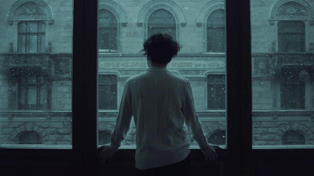 A man gazing out of a window.