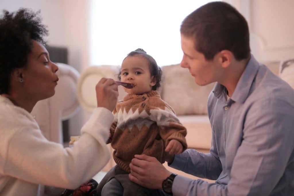 A man and woman with a child 