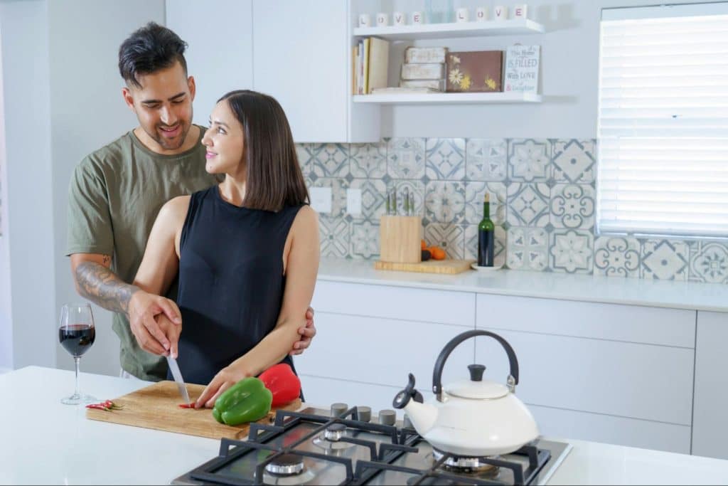 A man and woman at the kitchen