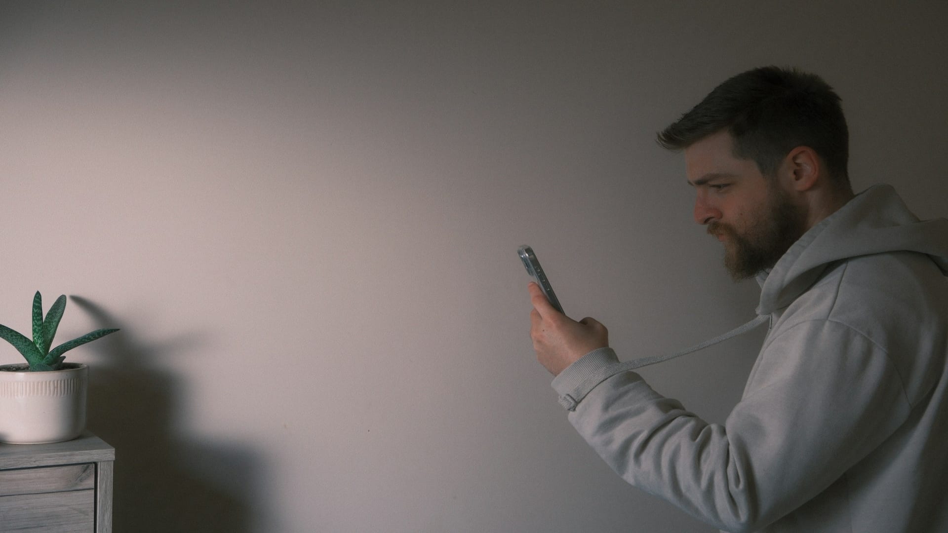 person scrolling phone thoughtfully