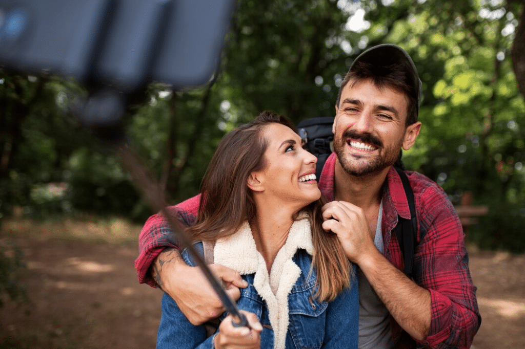 Happy and romantic couple traveling together in nature