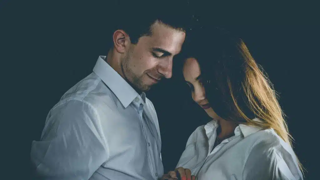 A man and a woman standing next to each other.