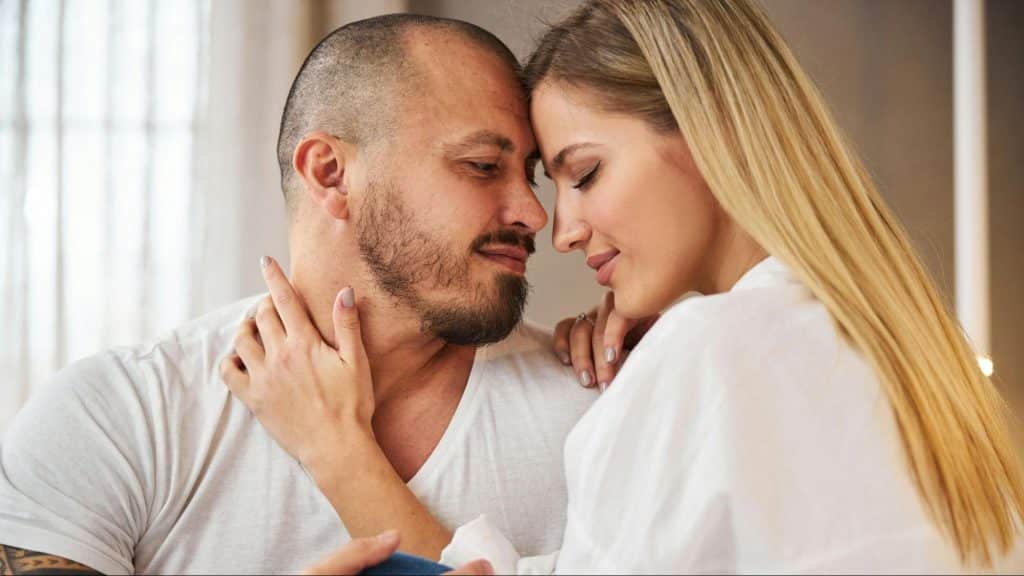 A couple leaning with each other