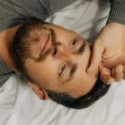 tired man in bed