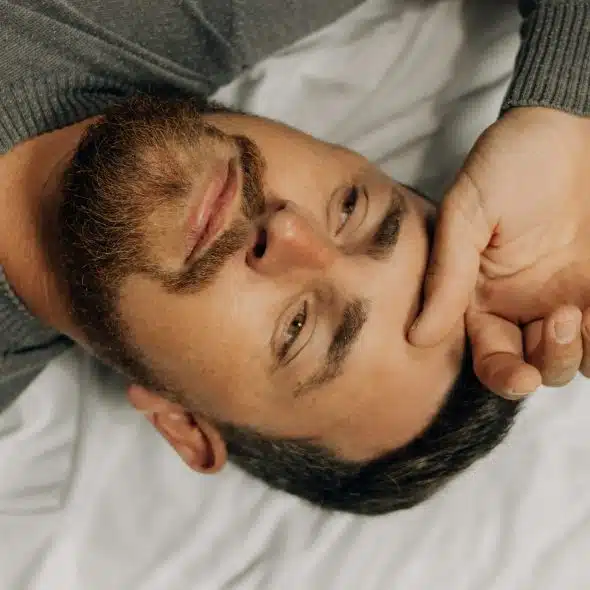 tired man in bed