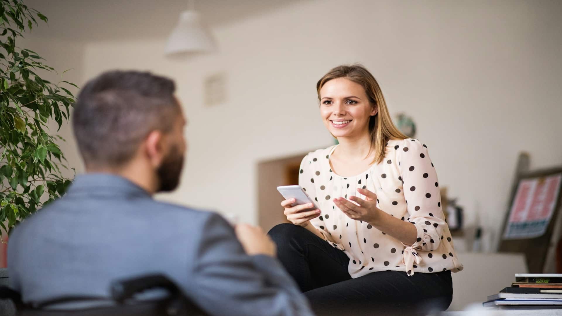 woman smiling calmly during conversation
