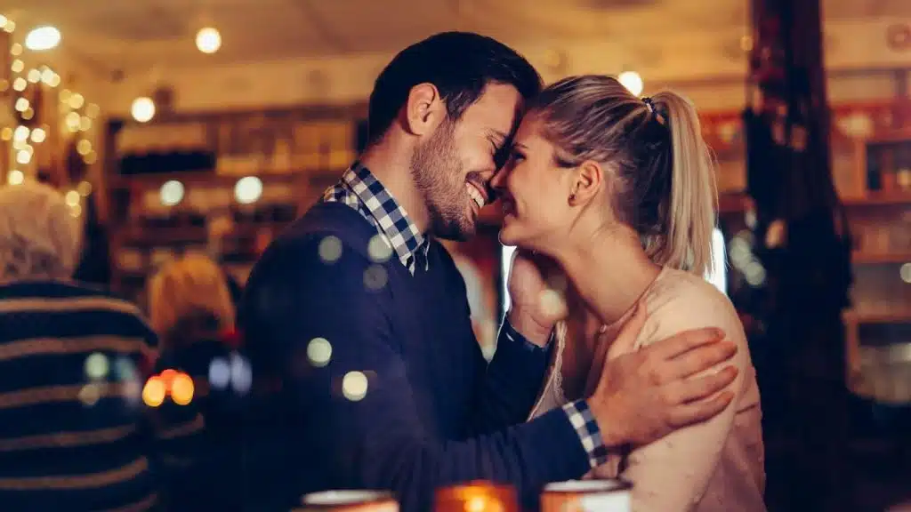 A man and woman close to each other.