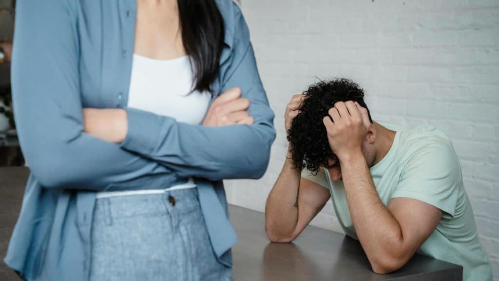 A man holding his head