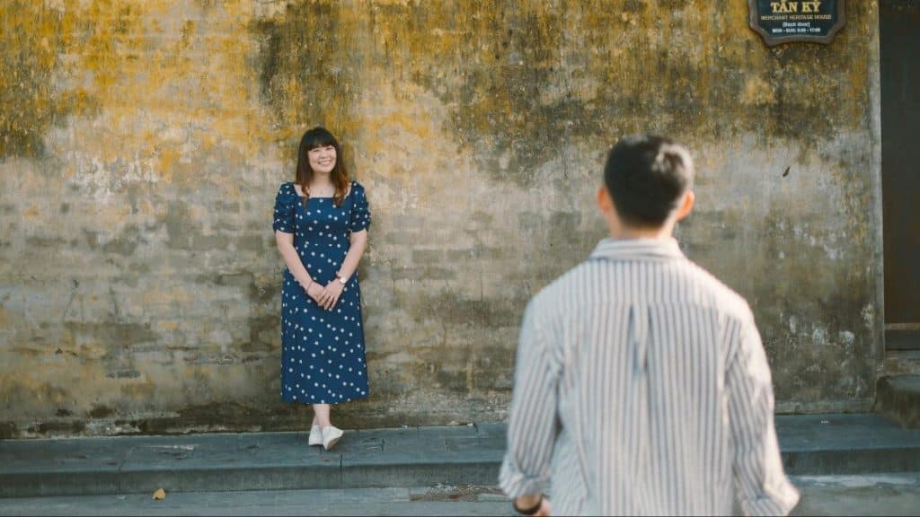 A man approaching woman