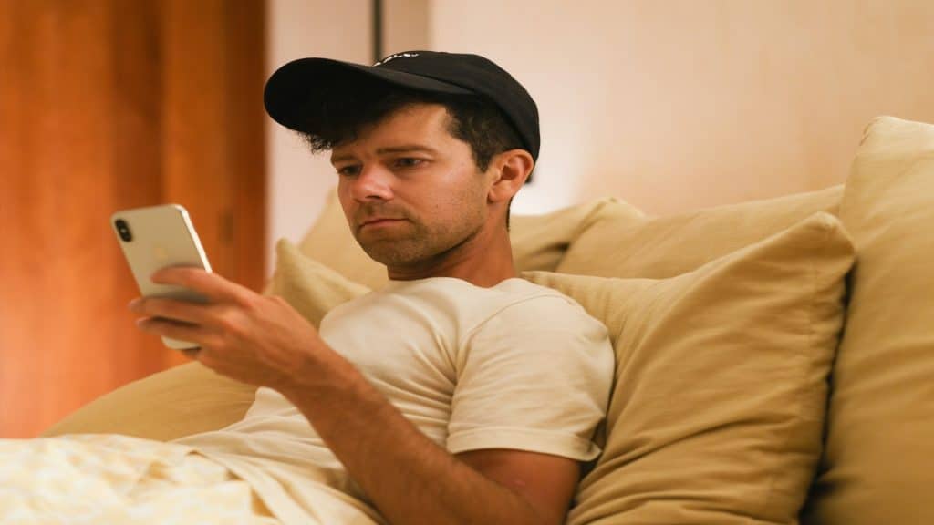 man using phone privately