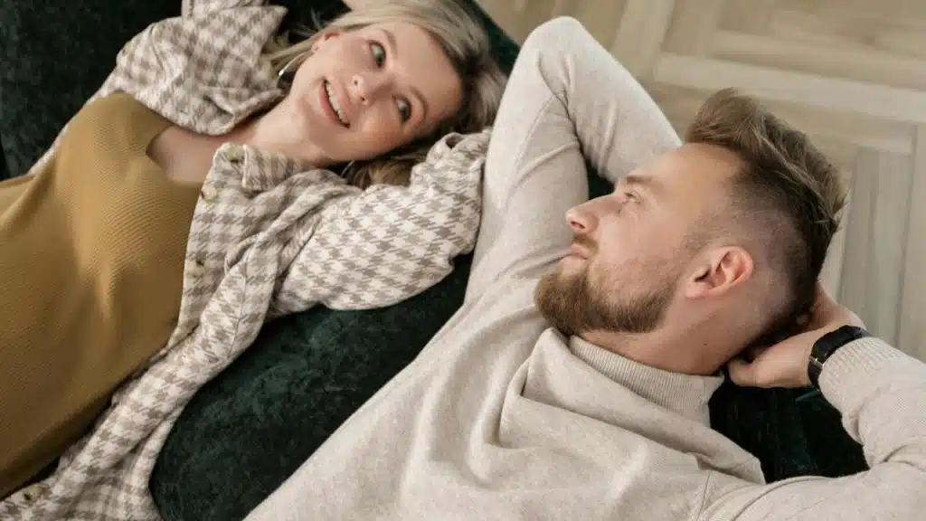 A couple lying on a couch