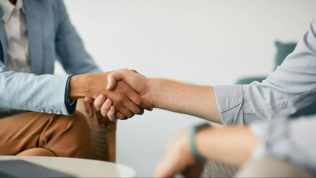 A man and woman holding hands