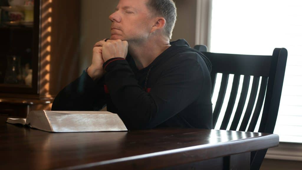 man sitting quietly reflecting
