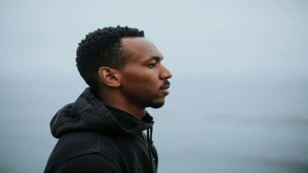man looking thoughtful alon