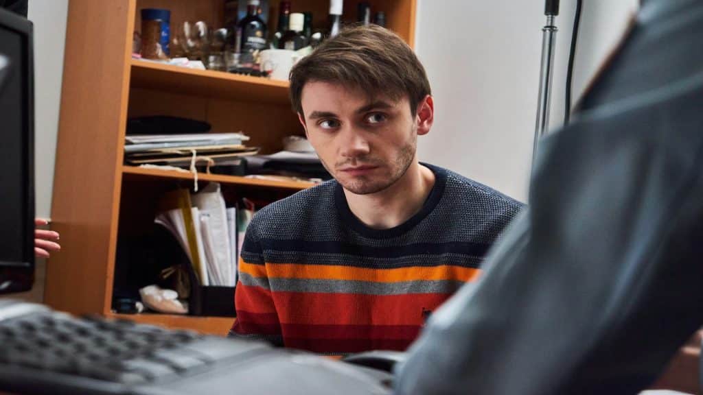 man looking alert during conversation