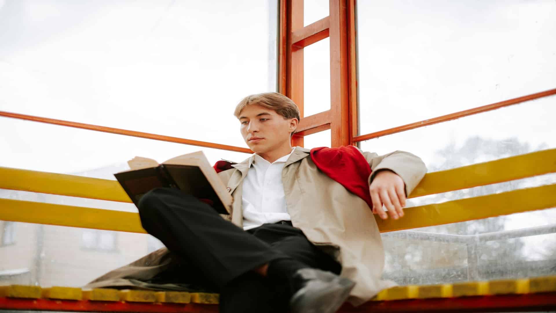 man sitting calmly outdoors
