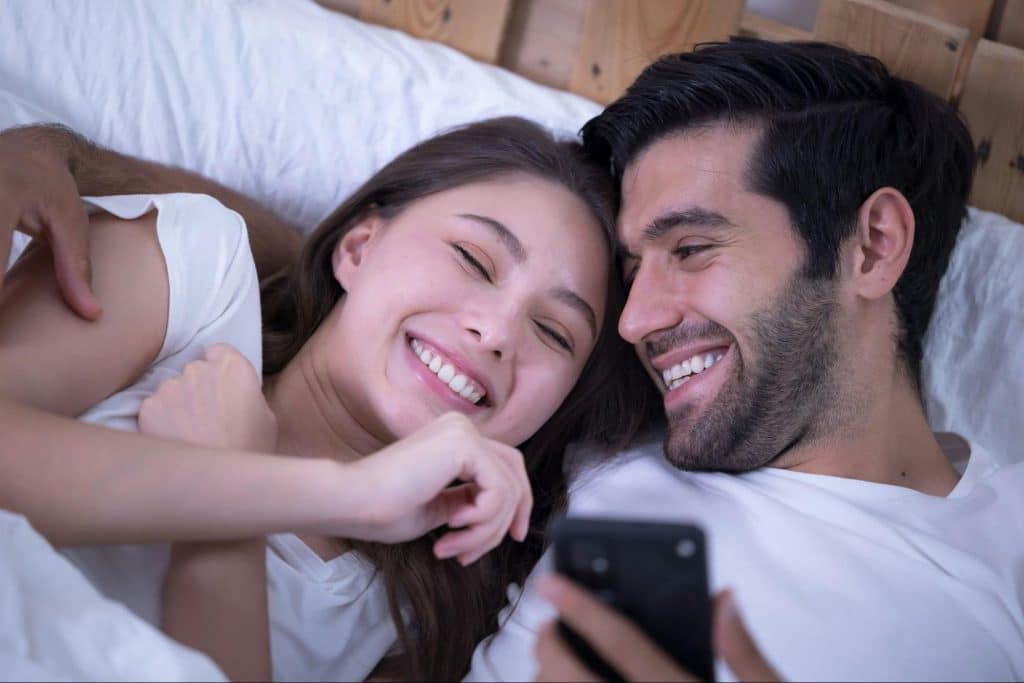 A man showing something to a woman