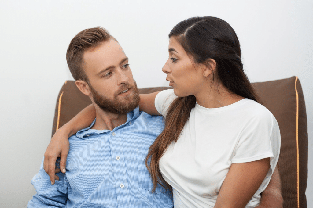 Woman calming a stressed man