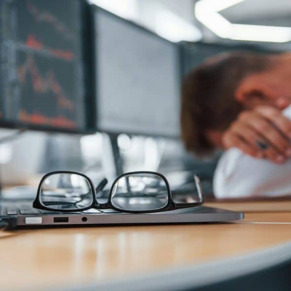 A man looking stressed at work