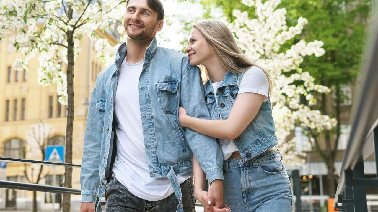 A couple walking arm in arm