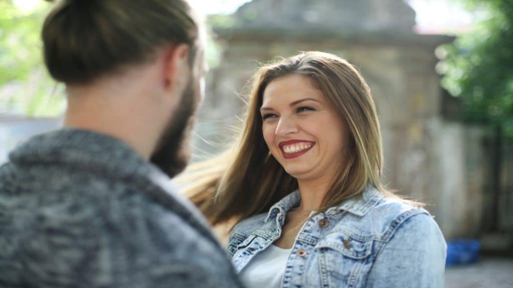woman smiling naturally during conversation
