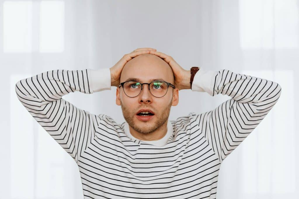 person with head in hands