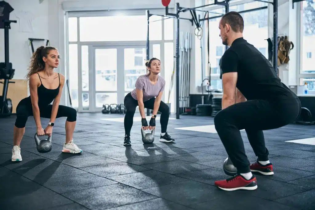 person lifting kettlebell