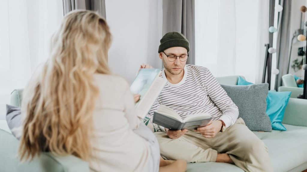 A man and a woman sitting on a couch