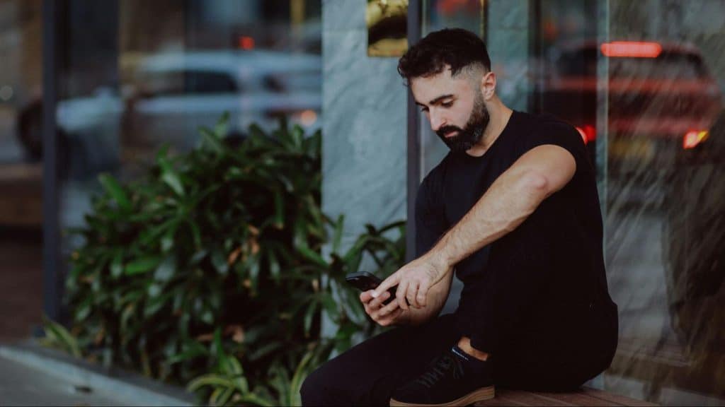 A man checking his ex girlfriend’s profile